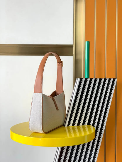 YSL LE 5 _ 7 in canvas and leather - 23 X 16 X 6.5 CM